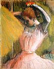 Edgar Degas Dancer arranging her hair painting